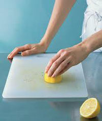 Cleaning cutting boards with lemon juice